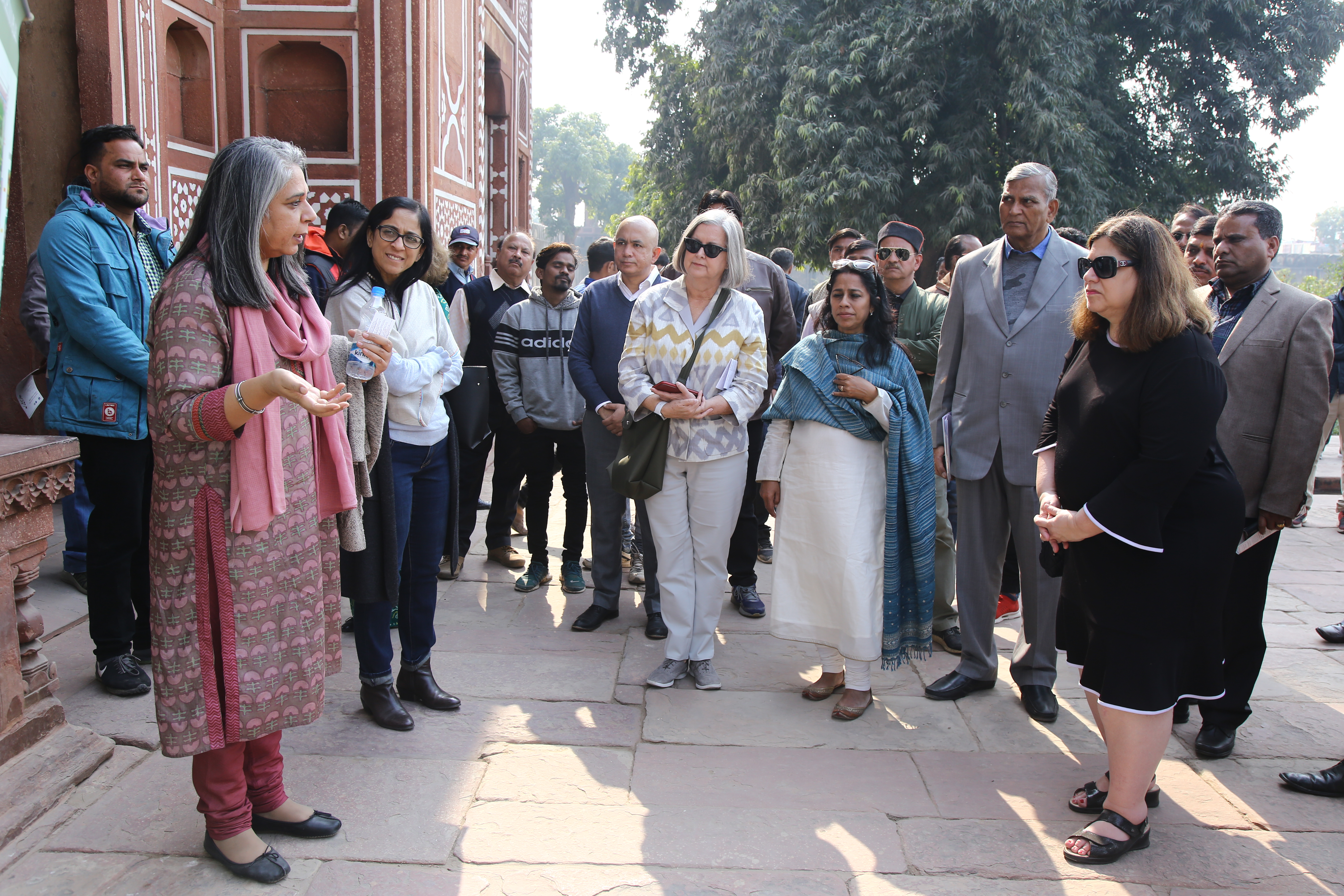 Guests tour completed conservation of the garden of the tomb of I'timad-ud-Daulah.