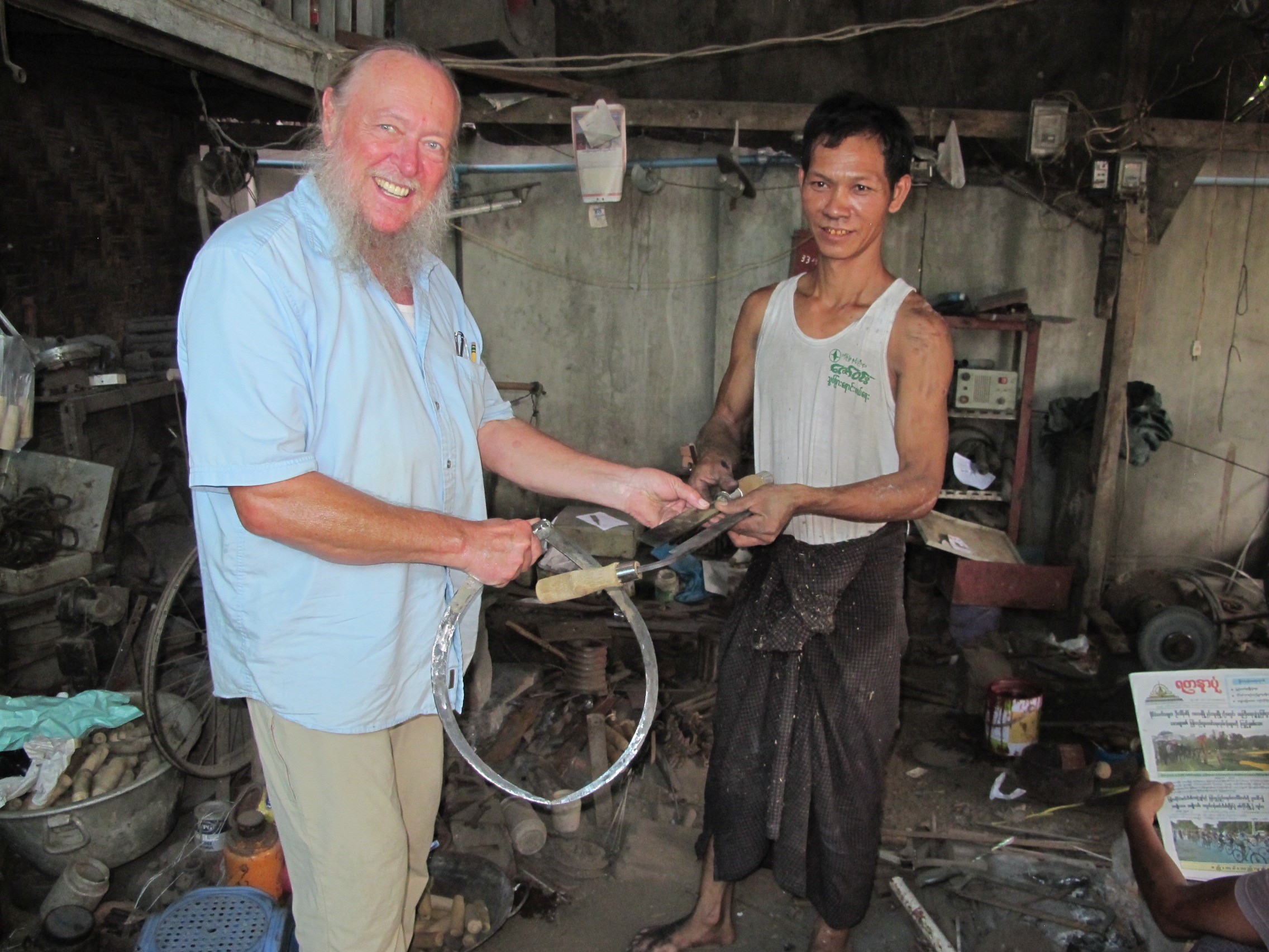 Since the master blacksmith, Than Naing Oo, spoke no English, and I spoke no Myanmar, we worked from photos and drawings. Photo by Laura Saeger.