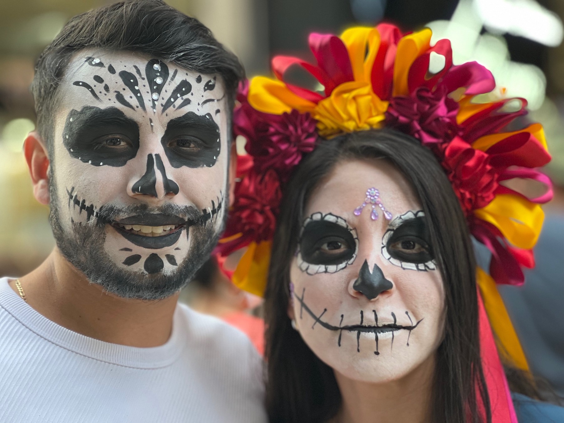 Portrait of two young people dressed for Dia de los Muertos festivities in Mexico City.