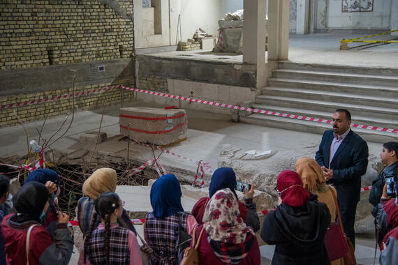 Zaid Ghazi Saadallah introducing the Mosul Cultural Museum during a school visit, 2022. Photo credit: Ali Al-Baroodi and Moyasser Naseer for World Monuments Fund.