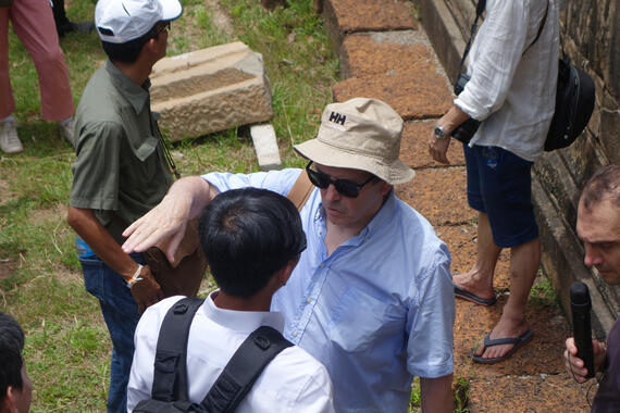 Pierre Andre Lablaude speaks with conservators at Angkor's Phnom Bakheng temple, 2014.