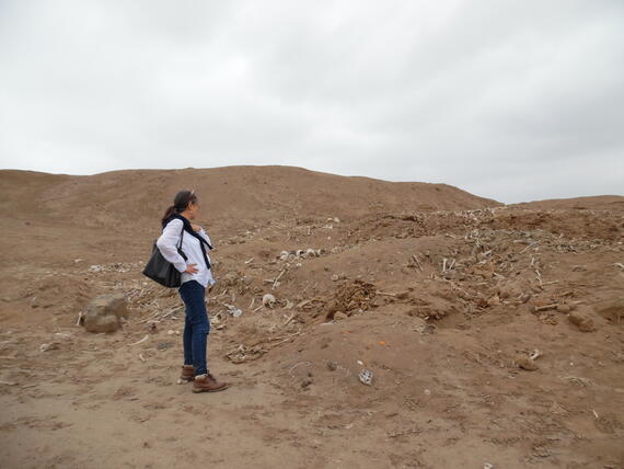 Martha Zegarra, Executive Director of WMF Peru, looks upon the looted areas of Cerro de Oro.