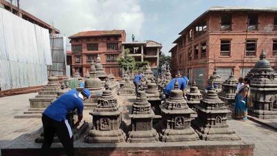 Careful cleaning of the chivas of the Swayambhunath temple, Nepal. 