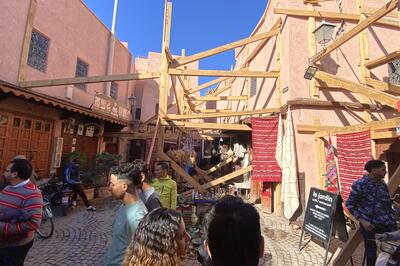 Street in Marrakech with support structures post-earthquake.