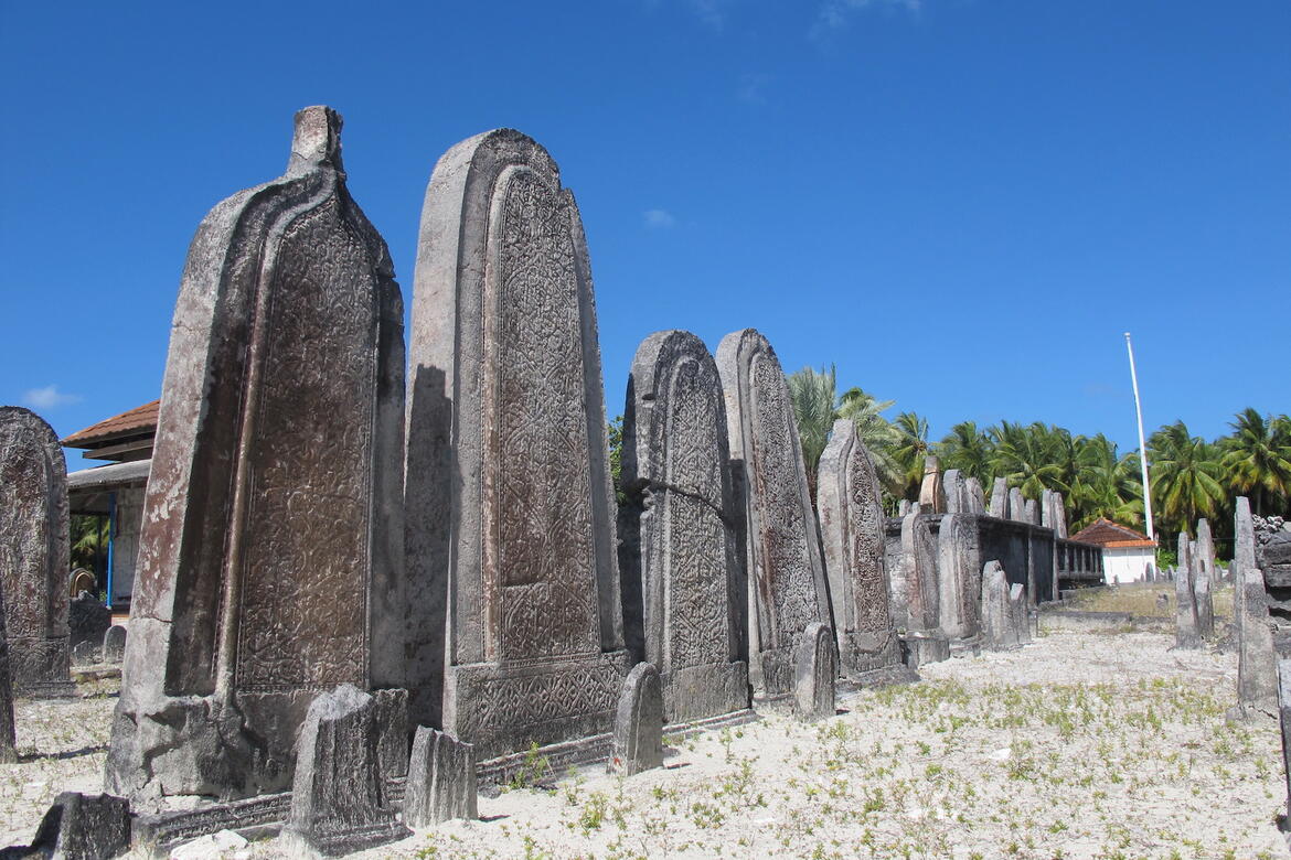 Grave markers made from carved porites coral, 2014.