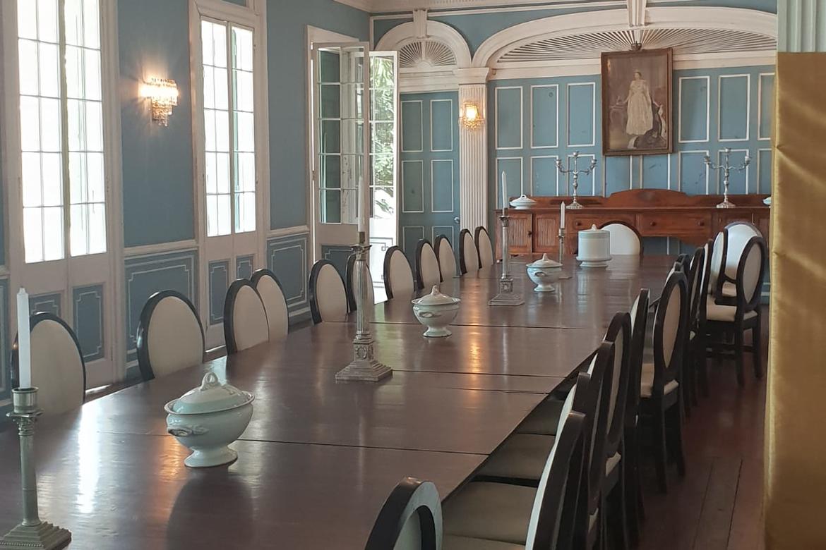 The Dining Room of the main building decorated with ceramic and porcelain wares with the Government House’s monogram