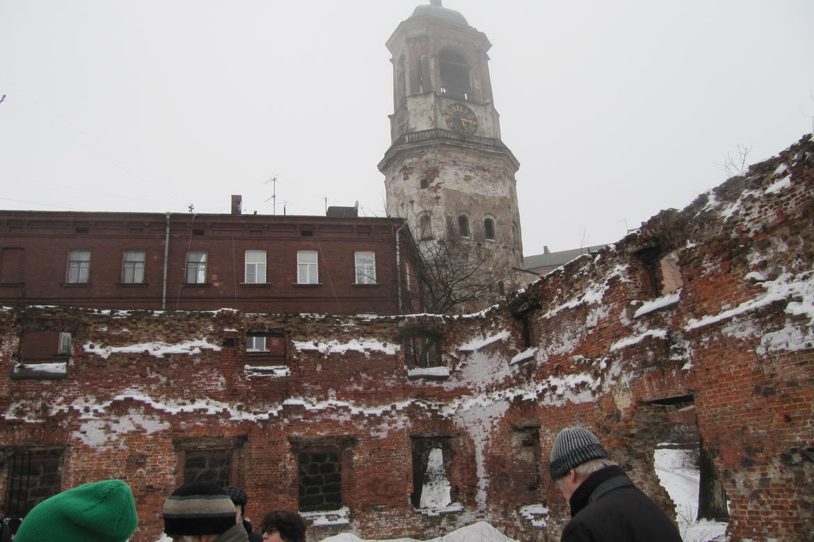 Vyborg’s unprotected clock tower appears behind the ruins of the old cathedral, 2016.