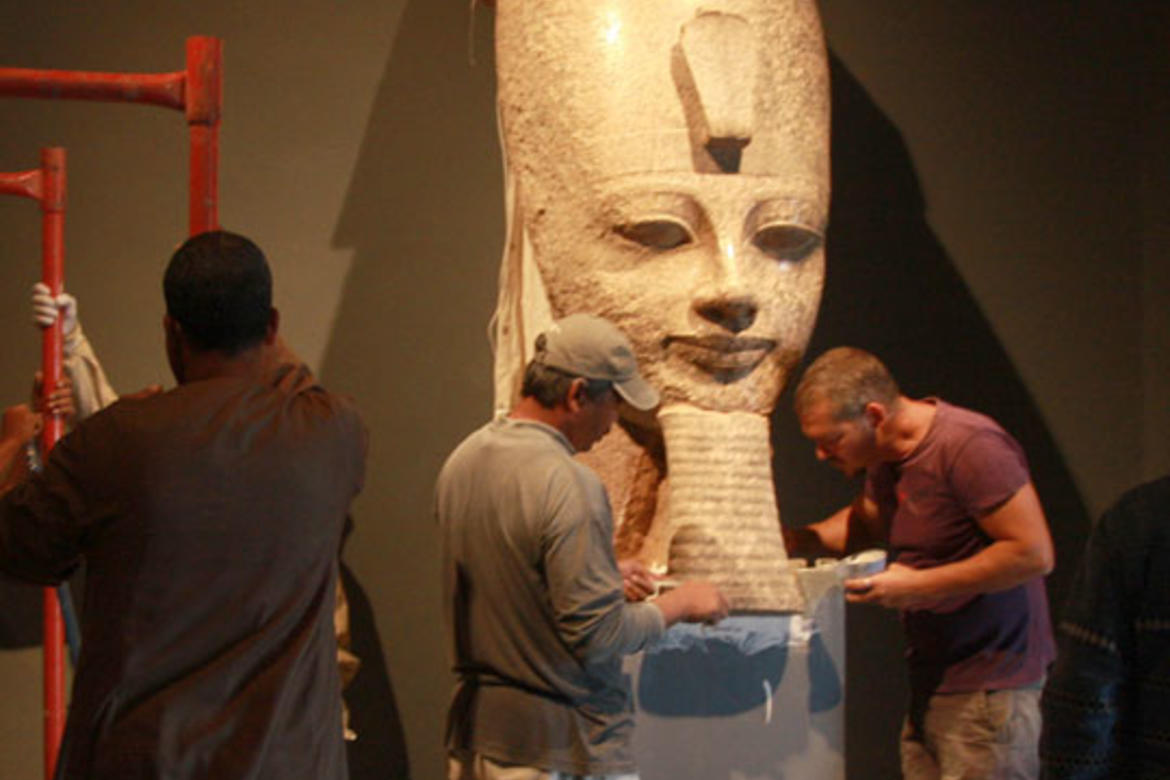 Conservators join the beard to the head of Amenhotep III.