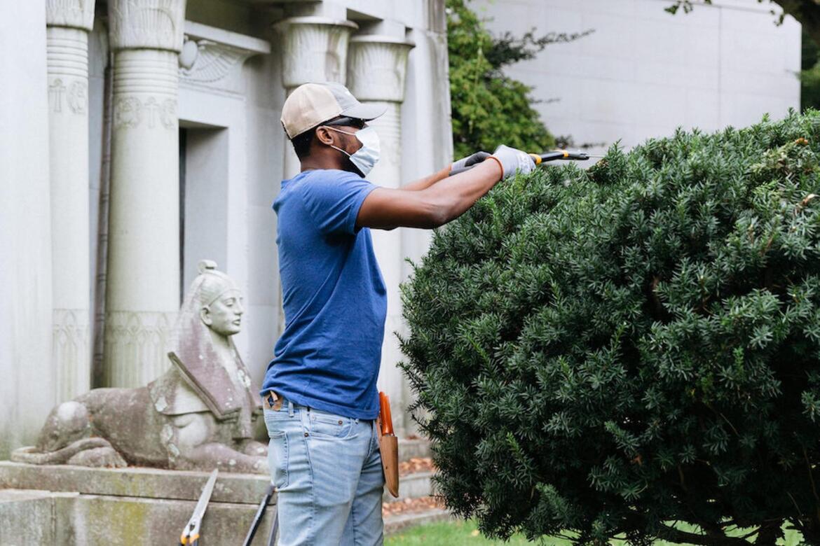 Intern Nick Tejada during training in landscape preservation at Woodlawn Cemetery in the Bronx, New York.