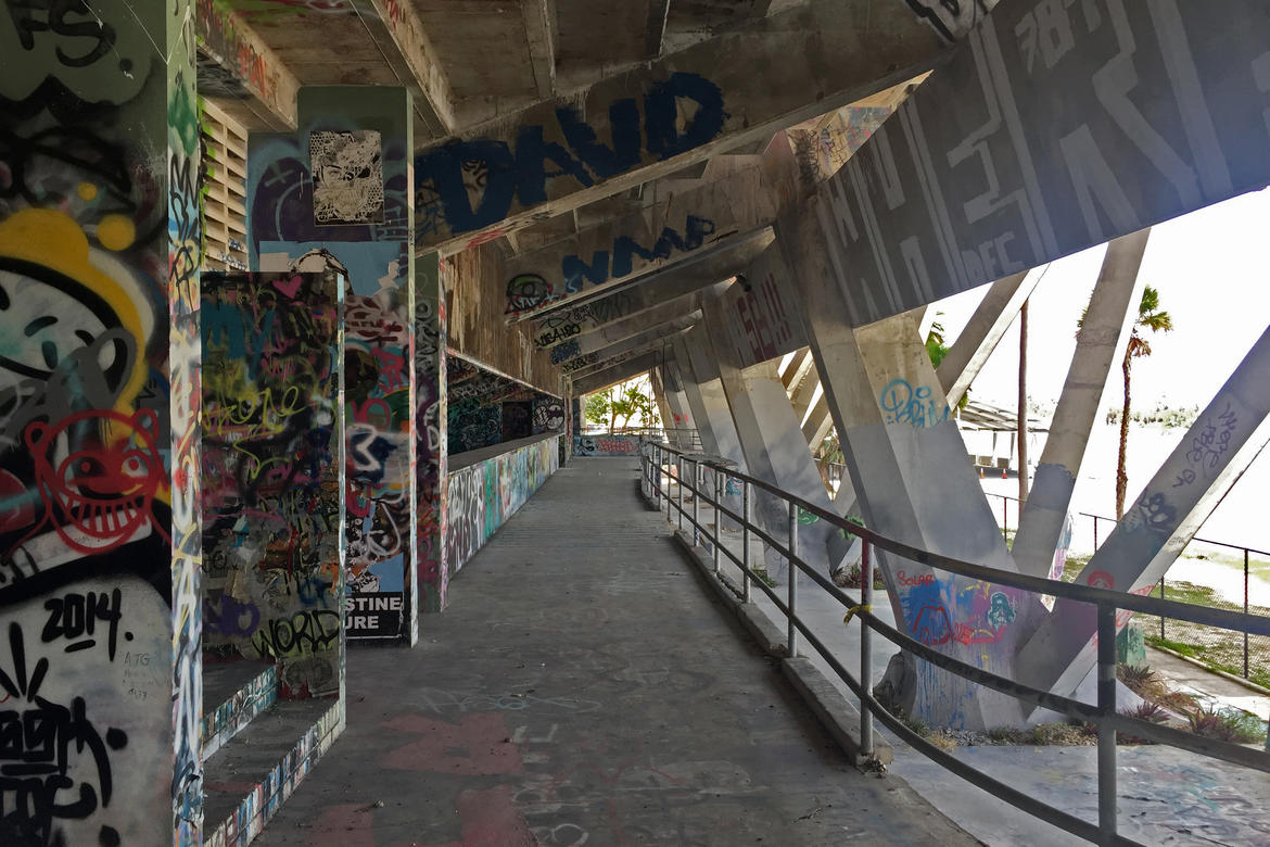 The graffiti-covered walkway underneath the grandstand. 