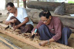 U Kan Khyun, right, with a woodcarver at Shwe-nandaw Kyaung.