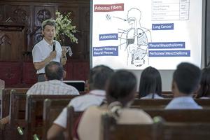 Epidemiologist Ken Takahashi leads an information session on asbestos, 2016