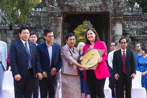 Bénédicte de Montlaur, President and CEO of World Monuments Fund, handing a ceremonial plaque to the Minister of Culture and Fine Arts at a celebration honoring WMF’s partners at Angkor Archaeological Park, Cambodia. Group standing with de Montlaur, from left to right: His Excellency Kol Bunly, Secretary of State at the Ministry of the Royal Palace; His Excellency Dr. Hang Peou, Director General of APSARA National Authority; Her Excellency Dr. Phoeurng Sackona, Minister of Culture and Fine Arts. 