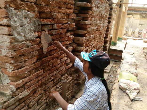A team member replaces the lime mortar on a monastery staircase, March 2016