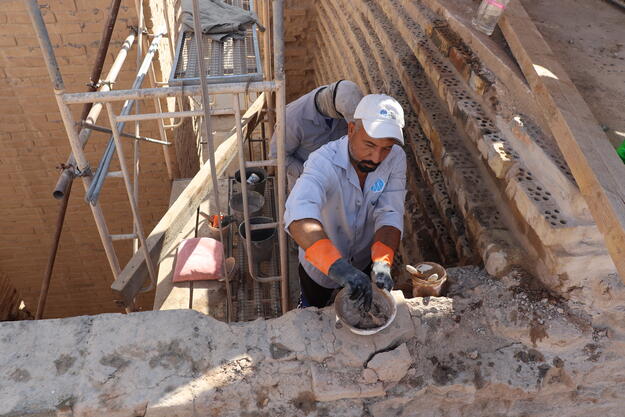 Ishtar Gate with Ali Amir undertaking modern masonry repointing, January 2022.