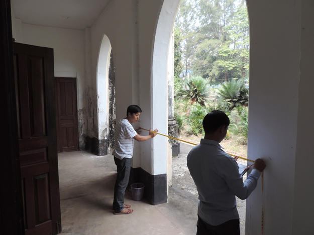 Engineers measure church for site plan, 2016. Photo: Tim Webster.