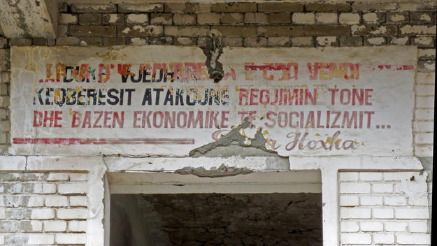 Political slogans painted on the walls were used to exert psychological pressure on the inmates; in this picture a quotation of dictator Enver Hoxha, with black letters used for terms referring to enemies of the regime, 2013