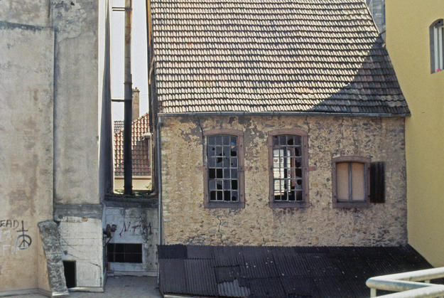 Façade with a steep pitched tiled roof , 1995