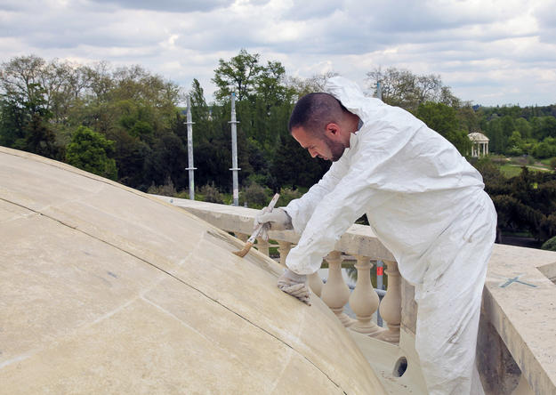 A conservator repairs the roof, 2012