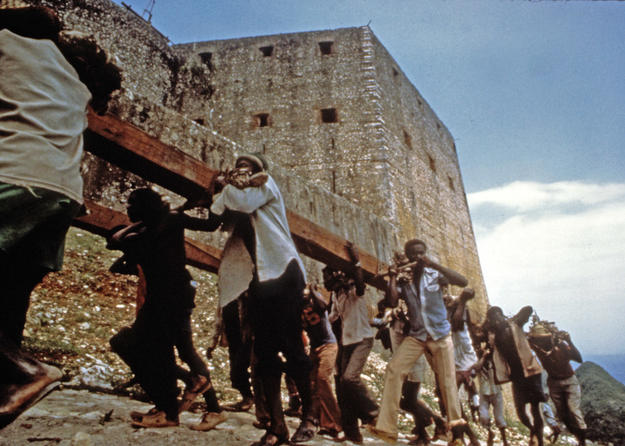 Local workmen hauled wooden beams, often weighing over a ton, up the peak to the fortress, 1987