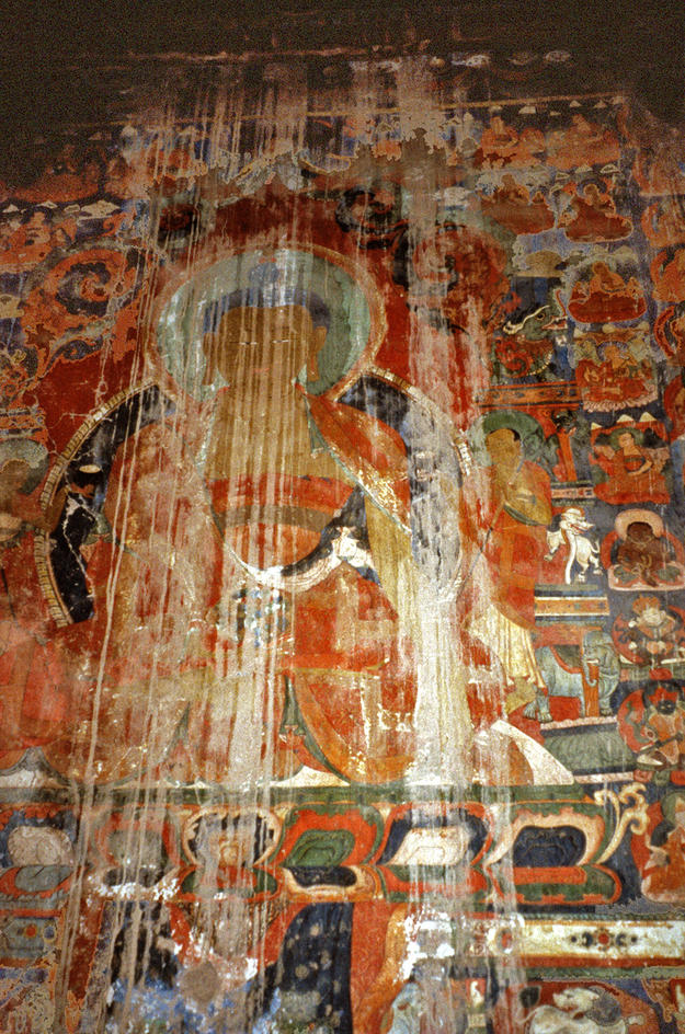 A damaged mural of the Buddha , 2002