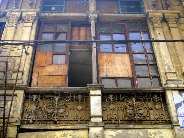 The Boix House features decorative pilasters, colonettes, and wrought iron grills, all in need of restoration, 2013