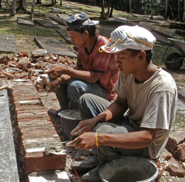 Local residents, trained in conservation, fix graves 82 and 83, 2011