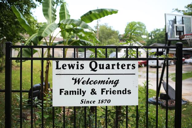 View of the entrance to the secluded Lewis Quarters, a smaller section of Africatown founded by Charlie Lewis, a survivor of the Clotilda, 2019. Photo credit: Mike Kittrell.