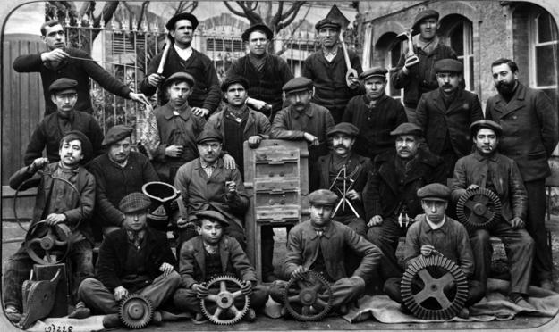 A group photo of employees of Averly Foundry at the turn of the twentieth century, posing with the tools of their trade, ca. 1900