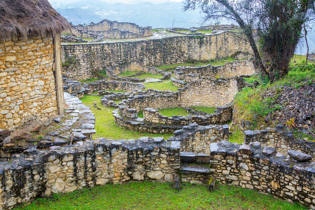 Remnants of round houses in Kuelap, ruined citadel city of the Chachapoyas cloud forest culture in mountains of northern Peru.