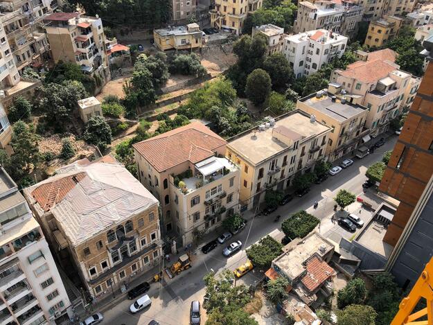 The lower part of the Fouad Boutros Corridor, showing historical urban facades on Armenia Street and the Tobaji garden behind, 2019.