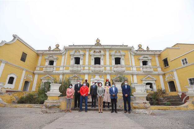 Official picture of the beginning of conservation work in June 2021 featuring: 1st line: Leslie Urteaga, Cultural Heritage and Cultural Industries Viceminister, Alejandro Neyra, Minister of Culture, Claudia Cornejo, Minister of Foreign Trade and Tourism, Pedro Rosario, Mayor of Rimac, Renzo Ruberto, Plan COPESCO Nacional. 2nd line: José Mendez, Executive Director Patronato del Rímac, Ludwig Meier, Patronato del Rimac Chair, and Martha Zegarra, WMF Peru Executive Director.