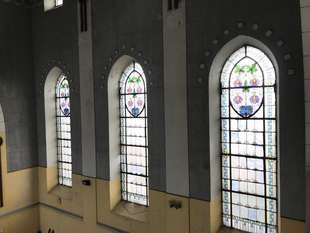 Interior view of the chapel with stained glass windows, 2019.