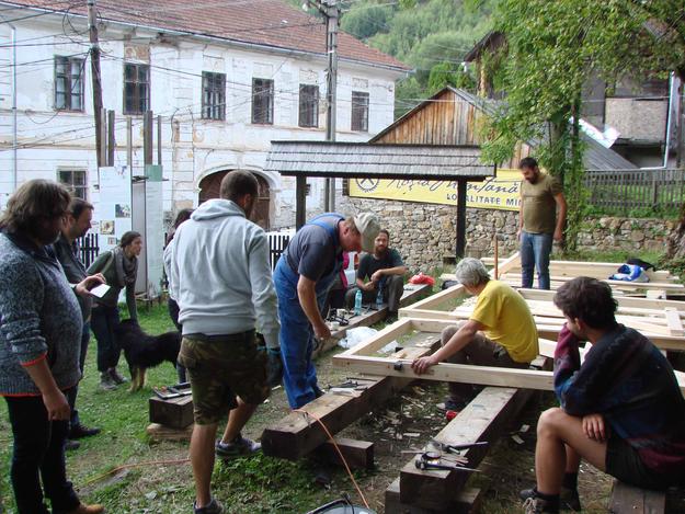 Building of wooden gate doors at the Unitarian parish house, part of a carpentry workshop during Heritage Week, 2016
