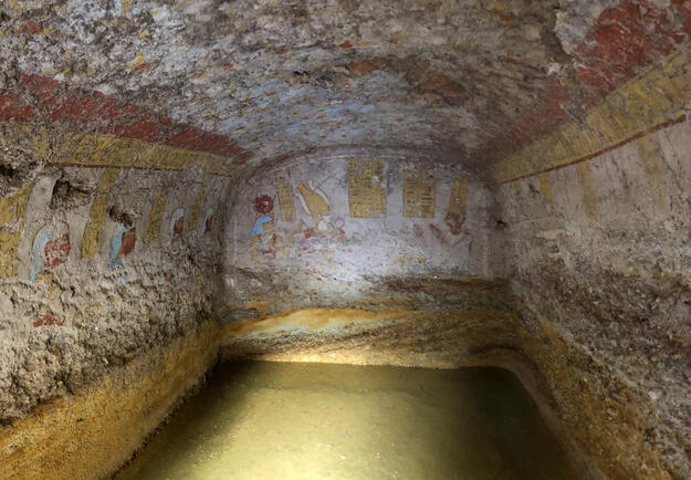 Groundwater-damaged burial chamber of Kushite Queen Yeturow (rear wall on the right), with Osiris and Isis, 2020.