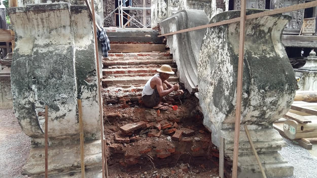 The southwest staircase steps, poorly rebuilt in the past with bricks, thin stone slabs, and cement stucco, in the process of being repaired with solid sandstone blocks, July 2016