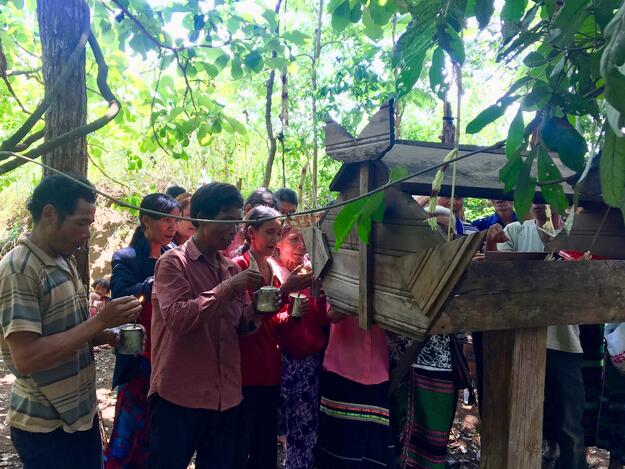 Bunong villagers from Bu Cheeng calling the spirits in front of their altar (filled with gifts) in  the context of the wer-brii-wer-nam ritual, Bu Sra area, 2019.