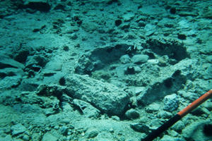 In this photo dating from the original discovery of Pavlopetri, a cist, or stone-built box grave is seen on the seabed, 1967