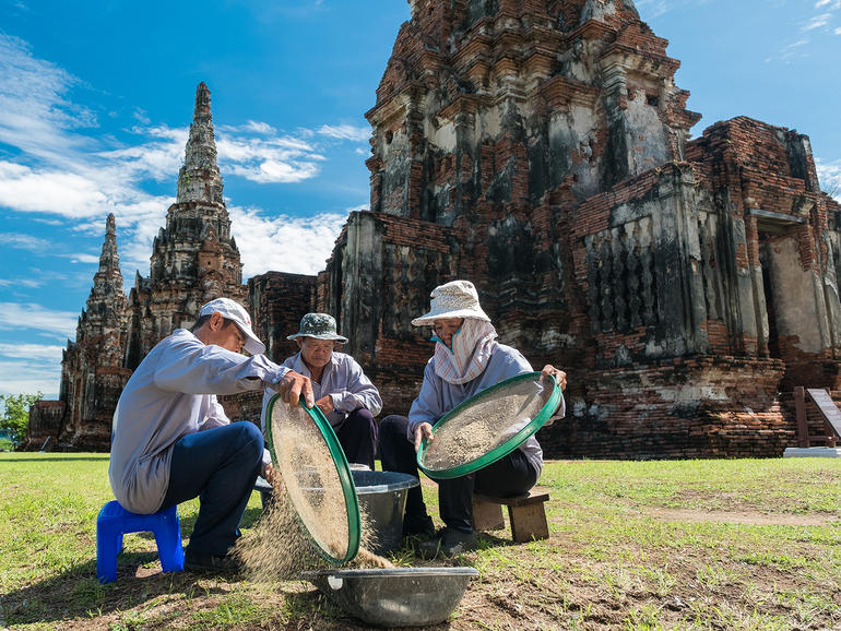 WMF technicians and conservators cleaning sand for mortar mixing at Wat Chaiwatthanaram.