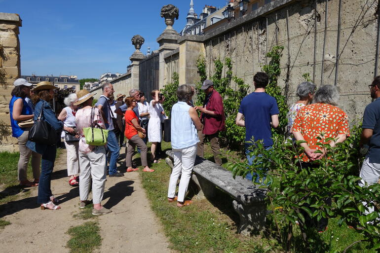 Visitors receiving an expert-led talk on the art of espalier, 2019.