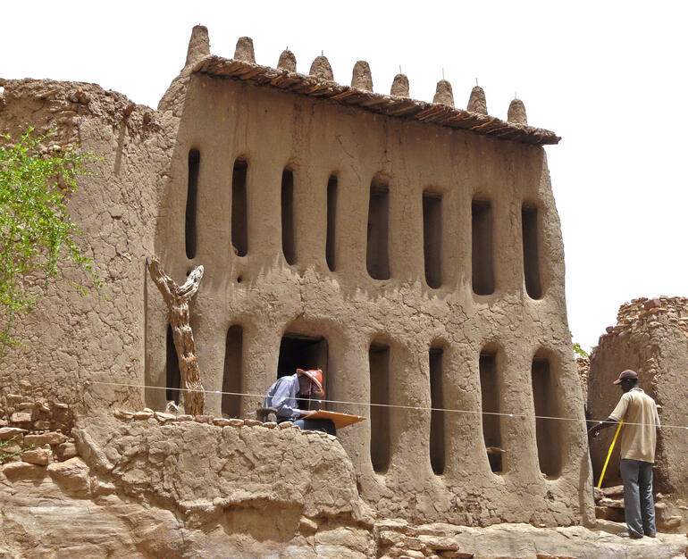 Conservators surveying the Arou Temple , 2009