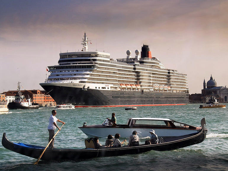 A cruise ships docks in the historic port, dwarfing the city and its famed gondolas, 2011