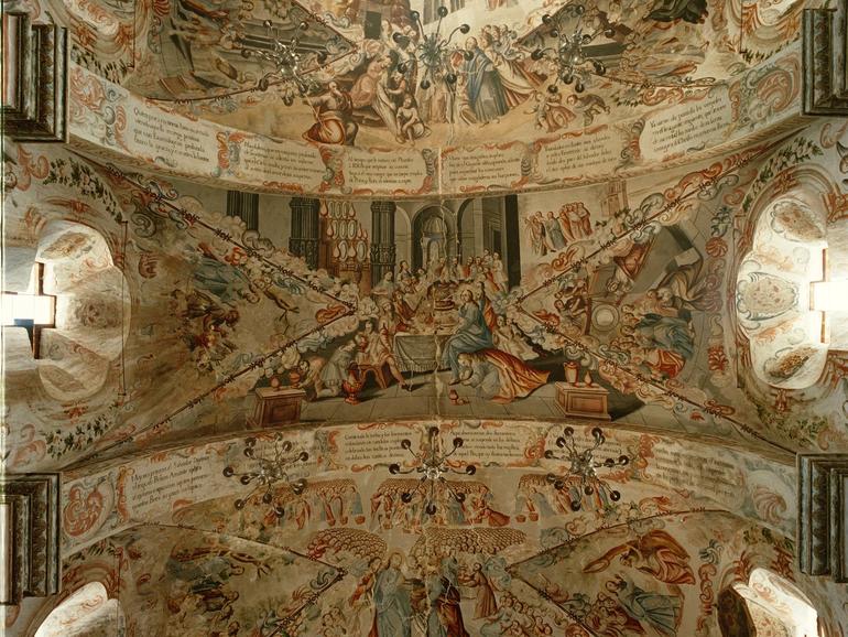 The richly decorated ceilings of the sanctuary depict scenes of the life of Jesus.