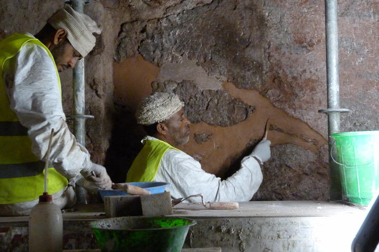 Priests working on building maintenance inside the Selassie Chapel, 2018