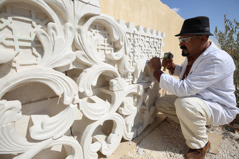 Mohammad Dorzi working on a wall fixture