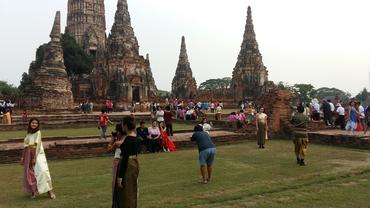 Fans of the show Love Destiny pose for photos in costume at Wat Chaiwatthanaram.