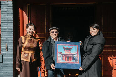 Nominator Odgerel, supervising architect G. Nyamtsogt, and Museum Director Otgonsuren Dugarsuren presenting the restored Choijin Lama Temple, Mongolia.