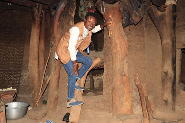 Ibrahim inside a traditional earthen house in Koutammakou, Benin and Togo. Photo credit: Ibrahim Tchan.