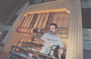 Marty Slawiak is captured by a local newspaper installing lighting in Buffalo Central Terminal.